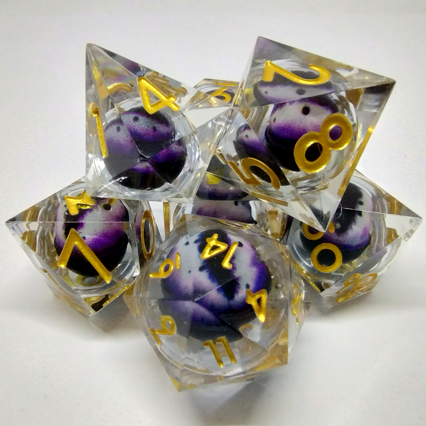 Liquid Core Dragon Eye Dice Kit - Translucent with Purple and White Dragon Eye in Black Suedecloth Pouch